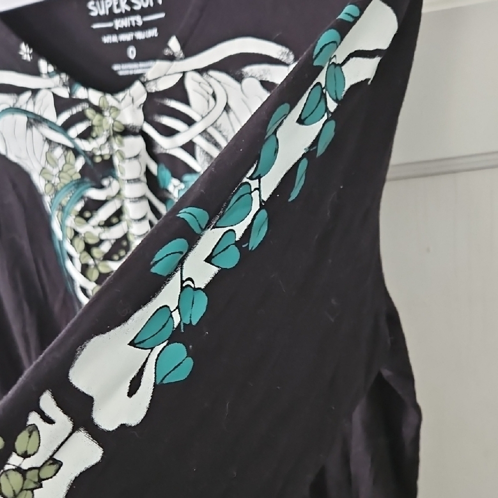Torrid Black Long Sleeve Ribcage Graphic Top with Teal Floral Accents - Picture 4 of 4